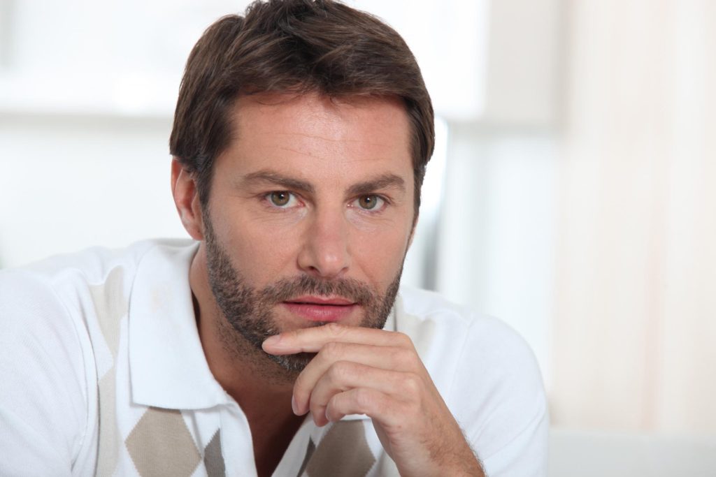 man wearing a white polo