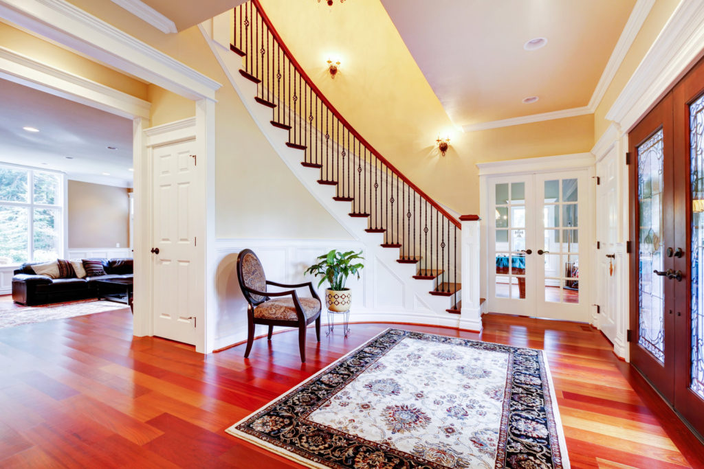 a nice house with wood tiles and staircase