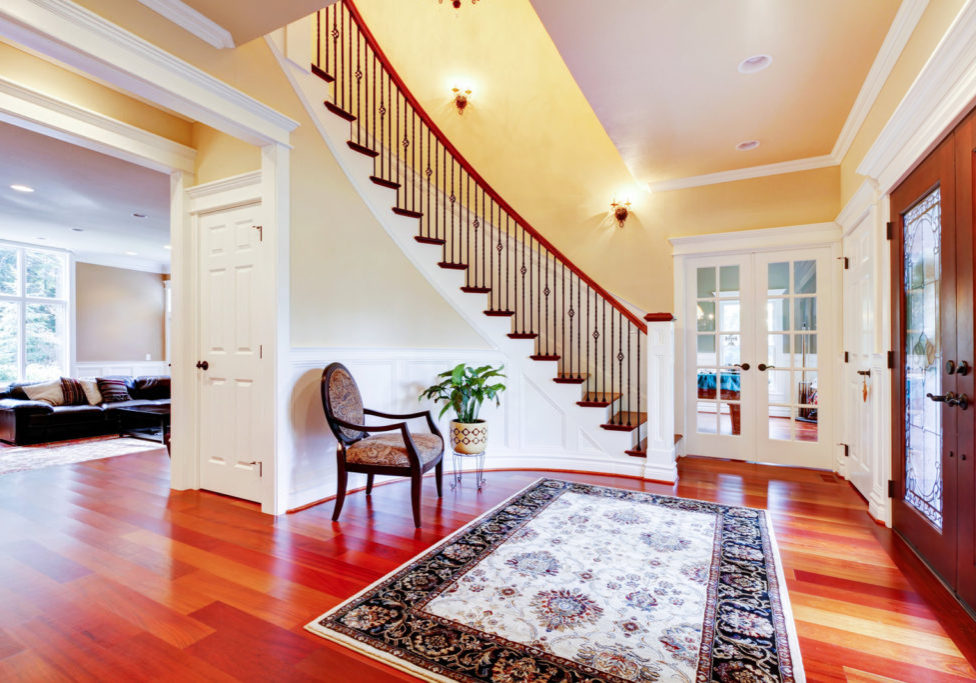 a nice house with wood tiles and staircase